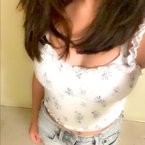 The brand is Hollister and the size is extra small white with blue flowers.